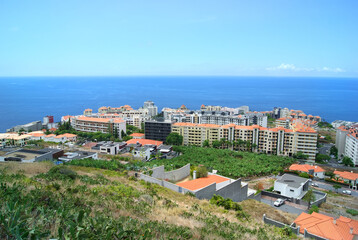 funchal residential area facing atlantic ocean, houses and buildings in travel resort area, madeira...