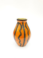 Mid-century modern orange ceramic vase with black lines pattern isolated