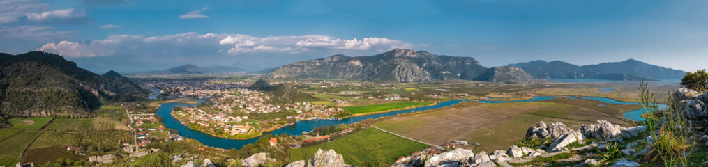 Fototapeta na wymiar A beautiful panorama of the Dalyan river valley with a view of the town, mountains and Iztuzu beach from the view point of the ancient city of Kaunos