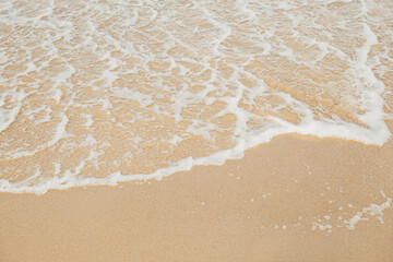 Fototapeta na wymiar Soft wave on the sandy beach