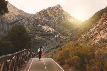 young man on a trip looking at a landscape.
healthy lifestyle.
sport.