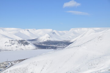 Panoramic view of snow capped landscape with hills in Khibiny, Russian Federation