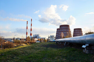 Industrial zone. Thermal power plant. Cooling towers,the chimney, industrial buildings. Heating of the city. Environmental pollution, an environmental problem.