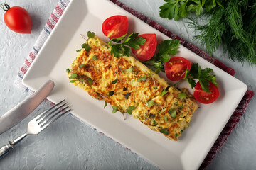 Fresh French omelet with fresh vegetables. Vegetarian food