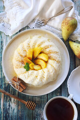 Dairy dessert. Rice pudding with baked pears, cinnamon and  honey