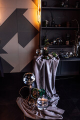 modern beautiful dark interior, room gray color, wardrobe shelves unusual gloomy decor table fabric...
