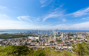Flag wavering in front of scenic view of Cartagena modern skyline near historic city center and resort hotel zone.