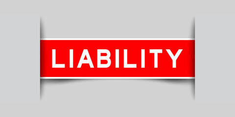 Inserted red color label sticker with word liability on gray background