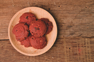 Red velvet cookies on wooden plate. Malay traditional cookies served during Eid Fitri.