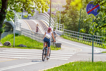 Cyclist ride on the bike path in the city Park
