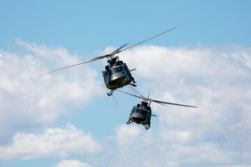 Two army helicopter in flight