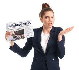 Confused businesswoman with newspaper on white background