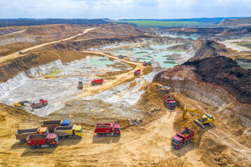 Quarry, mining and construction, excavators and trucks, view from above