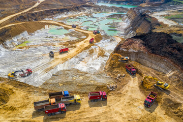 Quarry, mining and construction, excavators and trucks, view from above