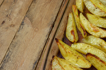 Fried potato wedges. Homemade fried food. Fried vegetables. Tasty food. There is a place for text