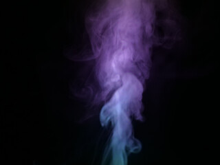Obraz premium Abstract color series. Composition of colorful smoke in motion. Fusion of purple and blue mist isolated on a dark background to inspire creativity.