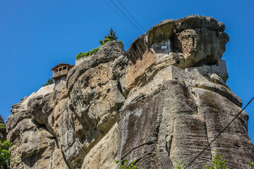 Fototapeta premium Holy Trinity Monastery (Agia Trias) - Eastern Orthodox monastery at the complex of Meteora monasteries. Peneas Valley, Greece. It situated at the top of a rocky precipice over 400 meters high.