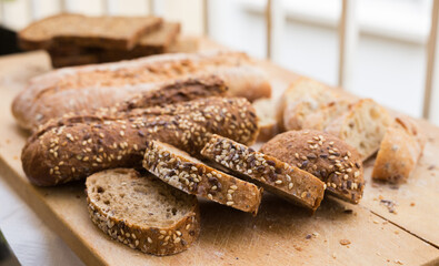 fresh loaf of bread on wooden board