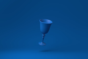 Blue Wine glass floating in blue background. minimal concept idea creative. monochrome. 3D render.