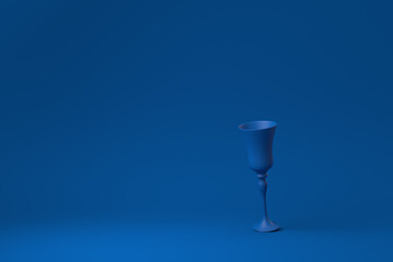 Blue Wine glass floating in blue background. minimal concept idea creative. monochrome. 3D render.