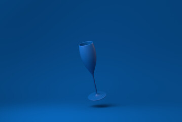 Blue Wine glass floating in blue background. minimal concept idea creative. monochrome. 3D render.