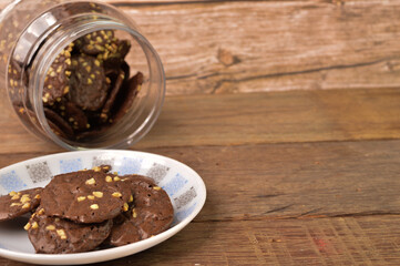 Chocolate brownie cookies on white plate. Malay traditional cookies served during Eid Fitri.