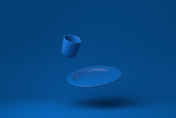 Blue Dish plate, glasses, mugs floating in blue background. minimal concept idea creative. monochrome. 3D render.