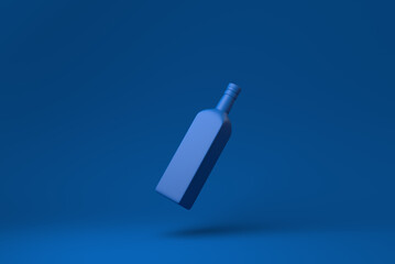 Blue brandy bottle floating in blue background. minimal concept idea creative. monochrome. 3D render.