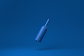 Blue Wine bottle floating in blue background. minimal concept idea creative. monochrome. 3D render.