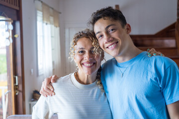 Portrait of grateful teenager man hug smiling middle-aged mother show love and care, thankful happy grown-up son in embrace cheerful mom, enjoy weekend family time at home together, bonding concept
 - Powered by Adobe