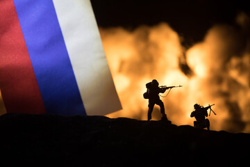 Turkey small flag on burning dark background. Concept of crisis of war and political conflicts...