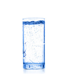Glass with pouring drinking water on a white background isolate