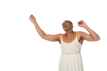 laughing african american transgender man in sundress dancing isolated on white