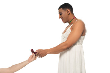 happy african american transgender taking wedding ring from man isolated on white