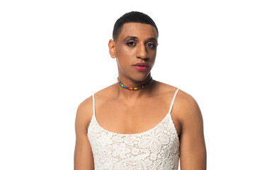 african american transgender man in sundress and makeup looking at camera isolated on white