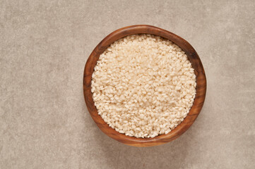 Albufera variety rice on wooden bowl