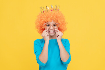 pure happiness. fancy party look. egocentric kid in clown wig and crown.