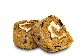 Closeup view of sliced prune sponge cake roll on white background.