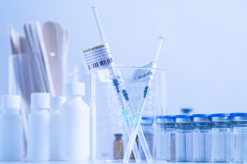 Focus on Coronavirus vaccine in ready to shot filling syringe with Covid 19 cure from vial, extreme macro. Concept of administration medication with sterile medical needle syringe injection. One dose.