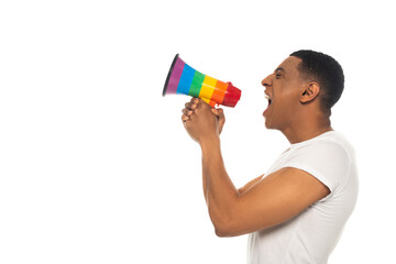 side view of african american man shouting in lgbt colors loudspeaker isolated on white