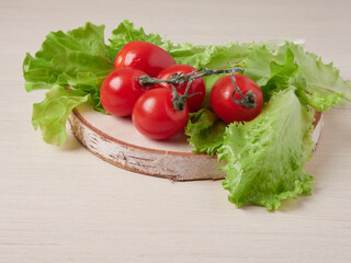 Full bowl of low calories salad with tomato, pepper, cucumber lies on scratched dark concrete. Vegetarian, dieting, healthy food. Close-up