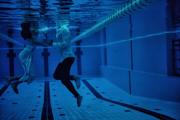 Male model posing in a swimming pool