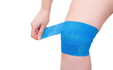 Blue elastic bandage on the knee joint to fix the sore kneecap, white background, isolate. Dislocation