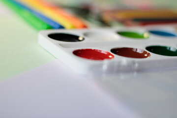 Pencils, felt-tip pens, paint for painting draw on concrete background, top view space for text