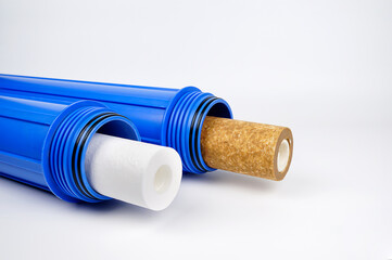 New and old water filter cartridges. Home water purifier system concept.