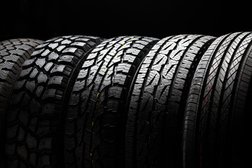 4 wd suv allroad tires, all terrain tire stack row, mud crossovers wheel - obrazy, fototapety, plakaty