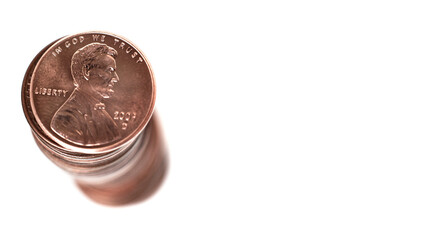 Stack of Pennies on White Background representing savings and wealth