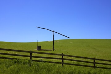 an old fountain in a rustic landscape