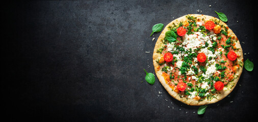 Crispy spinach pizza with ricotta, mozzarella and tomatoes