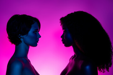 Profile side view portrait of two attractive alluring women vs looking at each other isolated over...